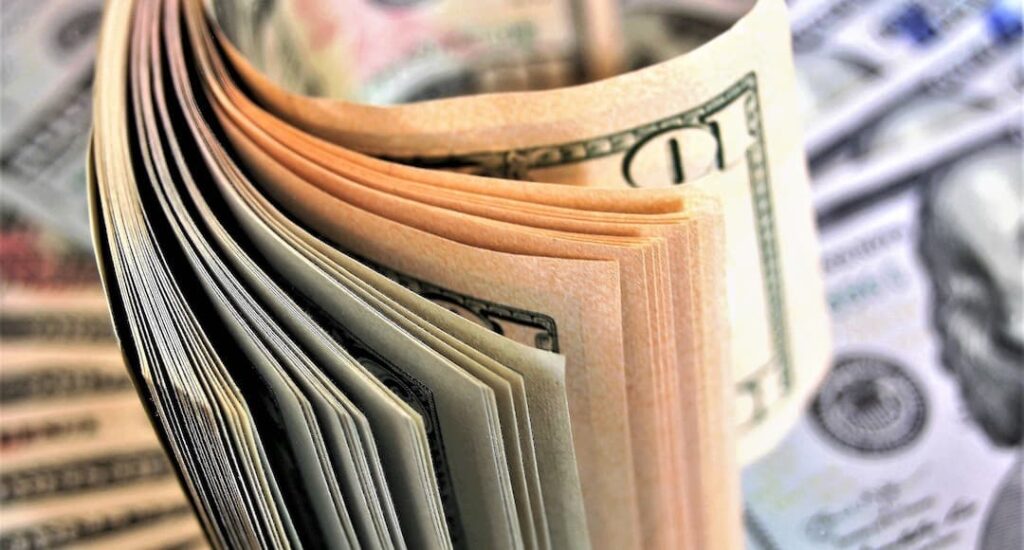 Image of cash to illustrate establishing a cash research so you can remain in the market for the long haul.