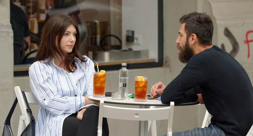 Couple discussing financial matters to illustrate how to stop fighting over money.