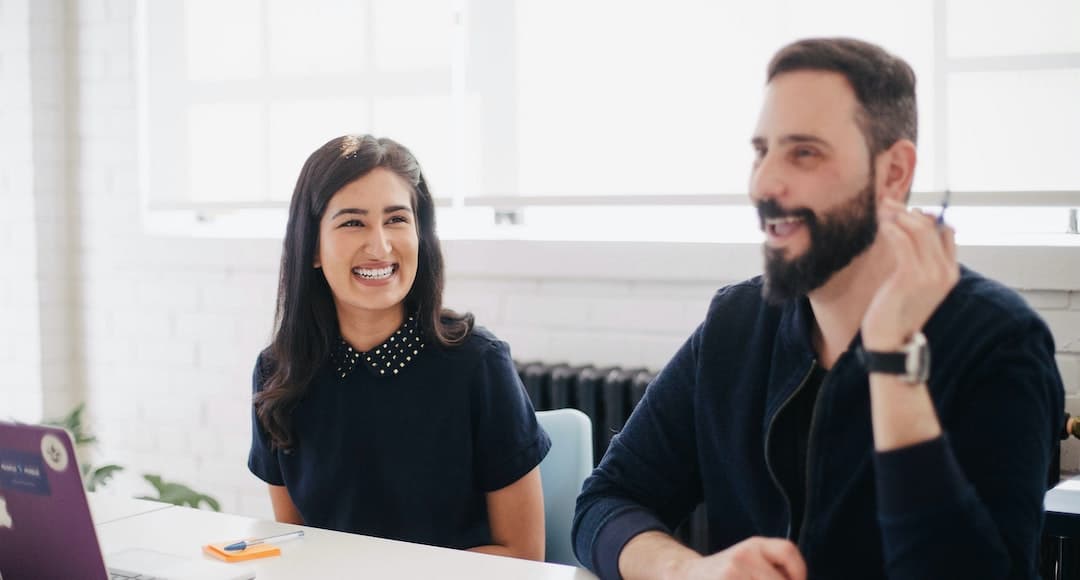 Couple having a discussion with a holistic financial planner.