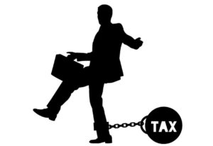 Illustration of a business person with a ball and chain around their leg with the word "tax" on it.